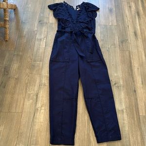 Navy blue eyelet zip up tie waist jumpsuit